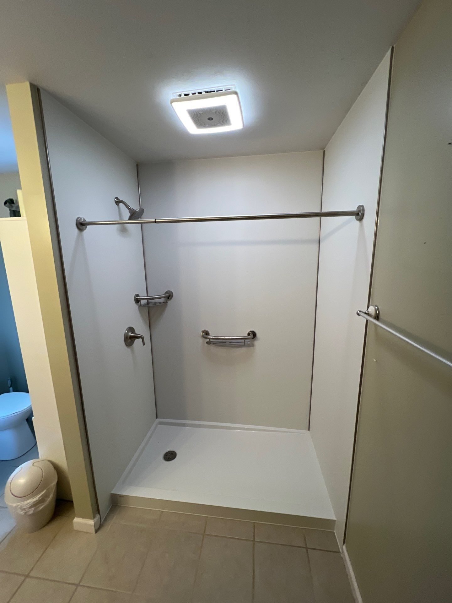 Walk-in shower with grab bars
