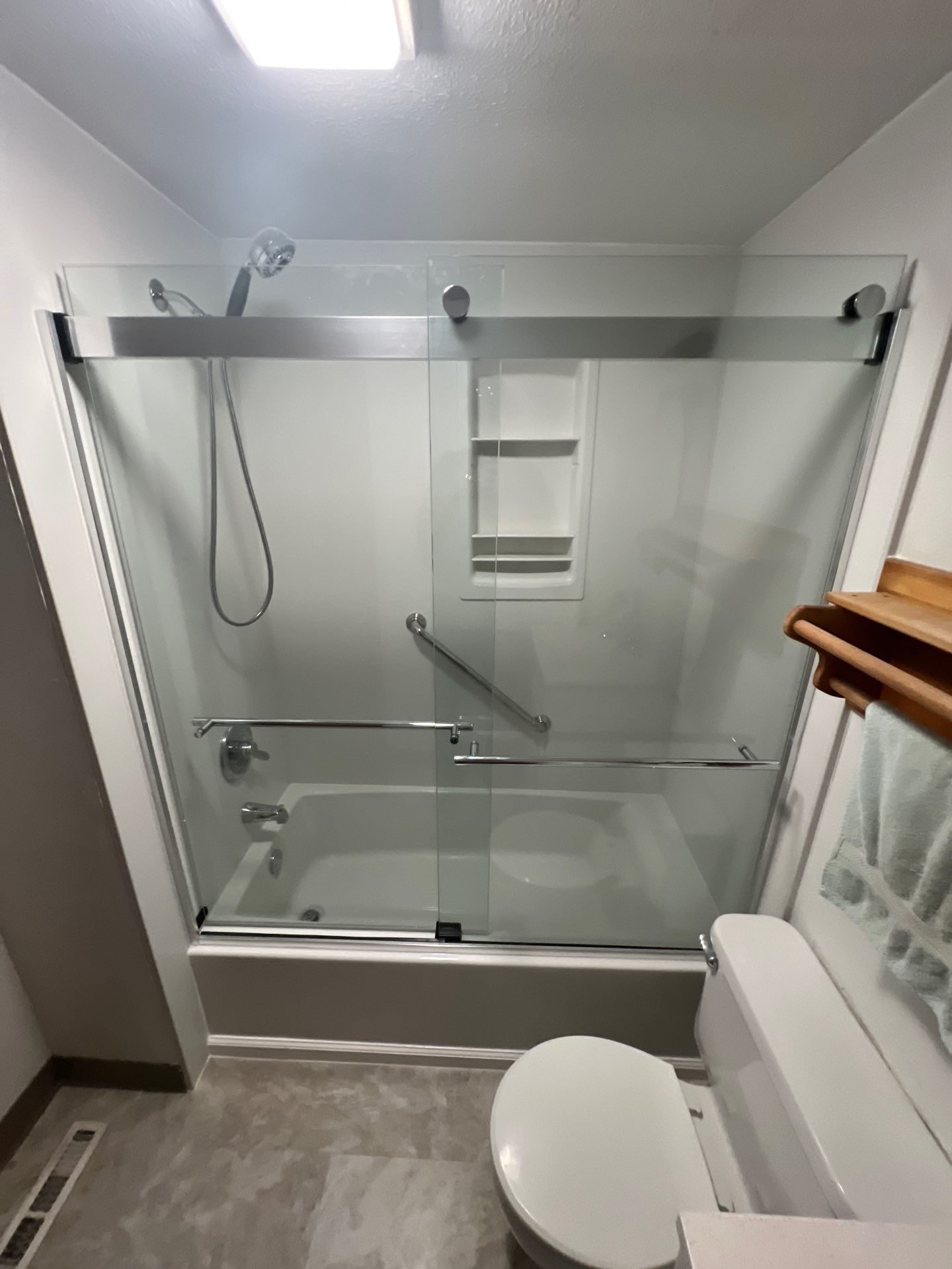 Tiled shower with glass enclosure
