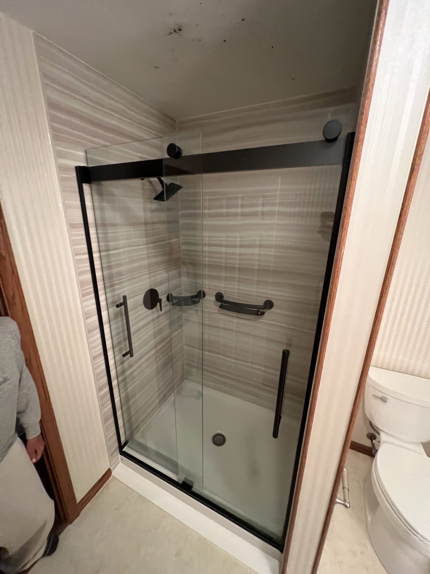 Marble-look corner glass shower