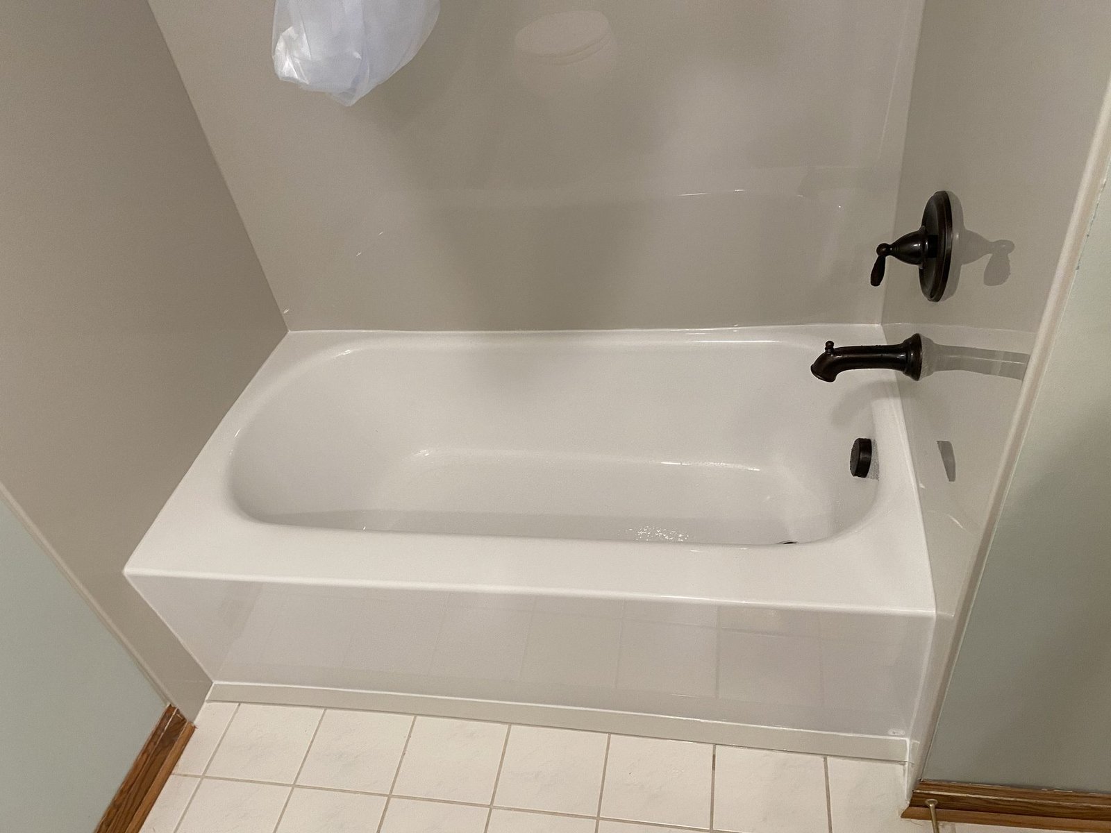 Bright walk-in shower with window and corner shelves