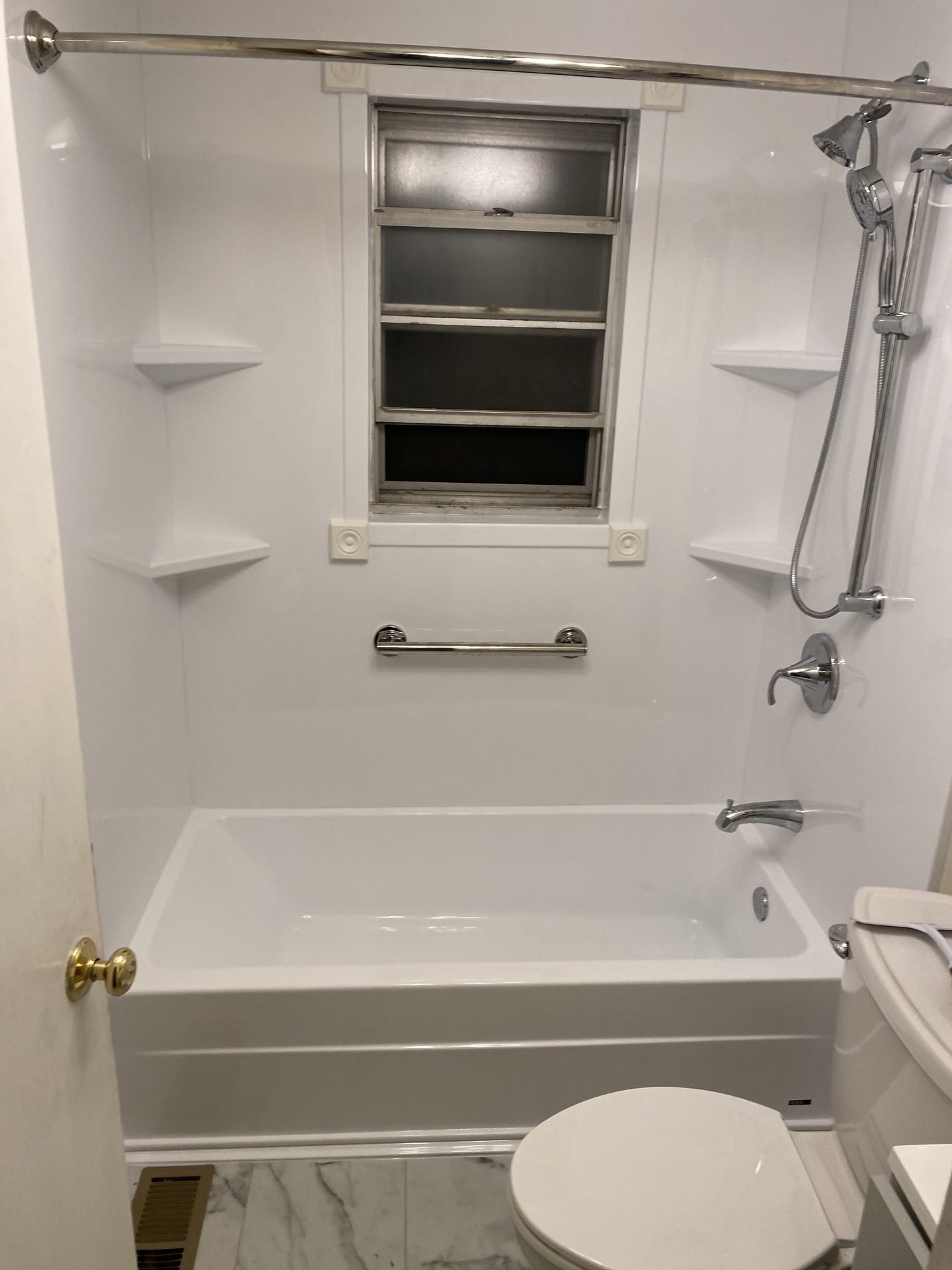 White tub-to-shower conversion with grab bar